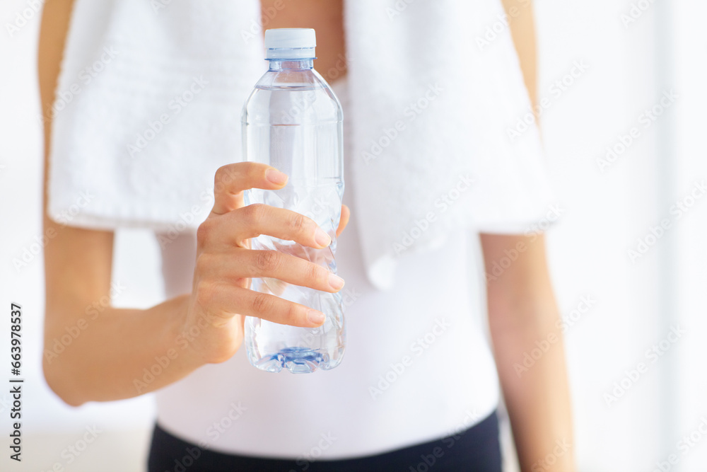 Water bottle, hands or woman with health, fitness or wellness for hydration after exercise or training. Thirsty sports person, closeup or healthy athlete with liquid or aqua after workout to relax Water bottle, hands or woman with health, fitness or wellness for hydration after exercise or training. Thirsty sports person, closeup or healthy athlete with liquid or aqua after workout to relax