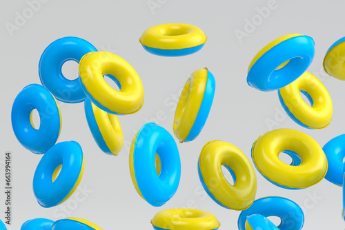 Many of flying inflatable ring for swimming pool isolated on white background © Vasyl Onyskiv