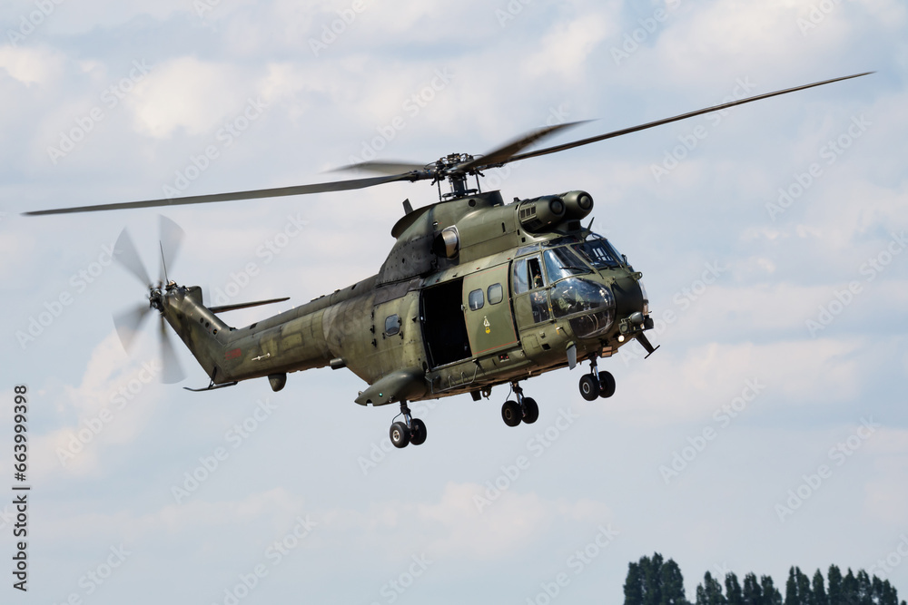 Untitled military helicopter at air base. Air force and army flight transportation. Aviation and rotorcraft. Transport and airlift. Military industry. Fly and flying. Untitled military helicopter at air base. Air force and army flight transportation. Aviation and rotorcraft. Transport and airlift. Military industry. Fly and flying.