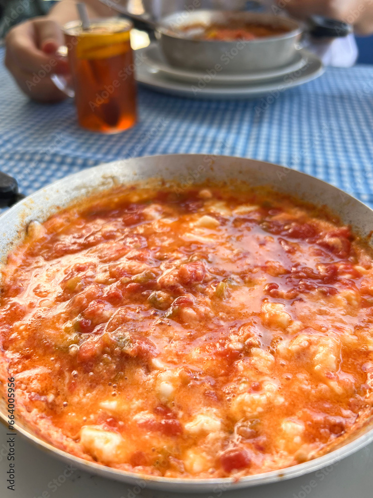 scrambled eggs known as menemen in Turkish over tea on table scrambled eggs known as menemen in Turkish over tea on table