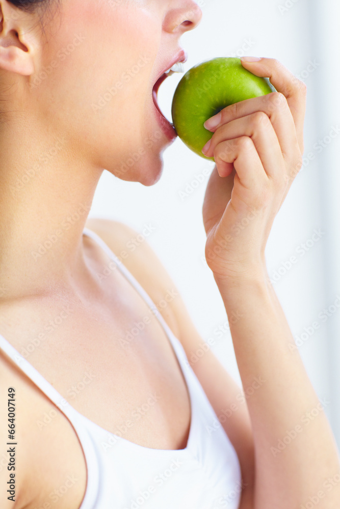 Closeup, eating and woman with health, apple or wellness with detox on a white studio background. Person, girl or model with fruit, nutrition or hungry with diet plan, food or natural with digestion Closeup, eating and woman with health, apple or wellness with detox on a white studio background. Person, girl or model with fruit, nutrition or hungry with diet plan, food or natural with digestion