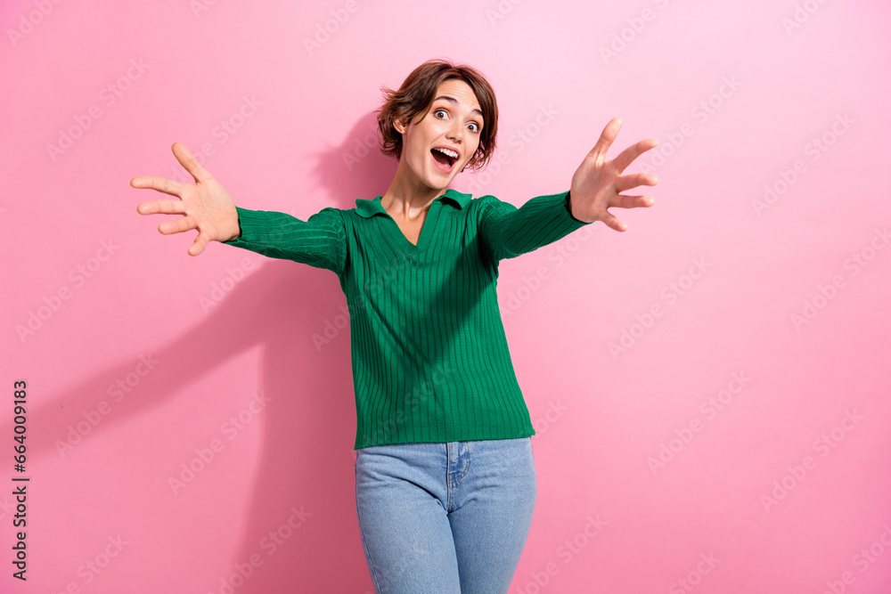 Photo of friendly young woman peaceful want hugs her family meeting satisfied welcome open palms isolated on pink color background Photo of friendly young woman peaceful want hugs her family meeting satisfied welcome open palms isolated on pink color background
