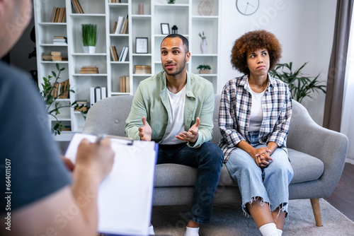 Effective marital therapy. couple sitting on couch at counselor's office