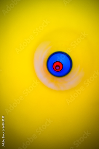 Yellow plastic background with blue and red circles