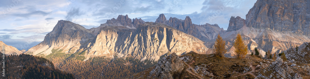 Colorful autumn alpine panoramic landscape with mountains and golden larches , Italy, Europe