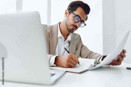 Suit businessman company planning paper holding laptop happy document winner office