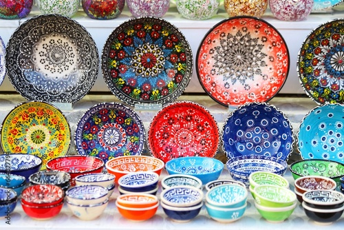 Fototapeta Naklejka Na Ścianę i Meble -  Colorful handmade dishes, plates, ceramics. Traditional greek ceramics, island Kos. Close up.
