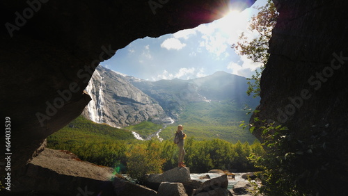 Fotografie A lonely traveler alone with the delightful nature of Norway - a valley surround
