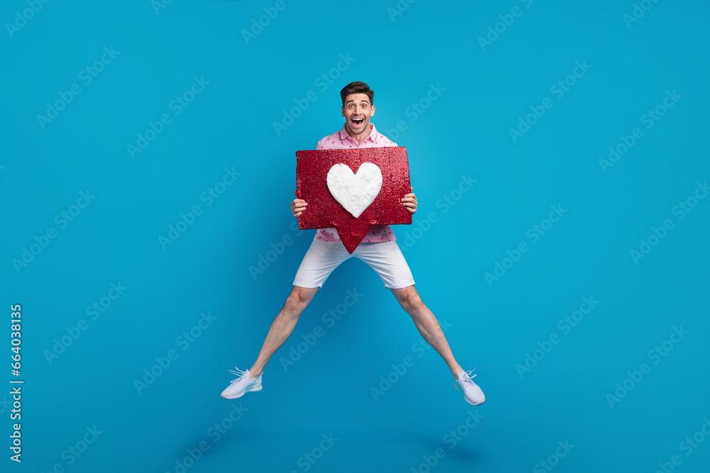 Full length portrait of energetic active person jumping arms hold like notification collage isolated on blue color background