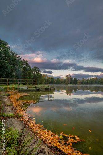 Stromovka park with trees forest and pond Bagr in autumn morning photo