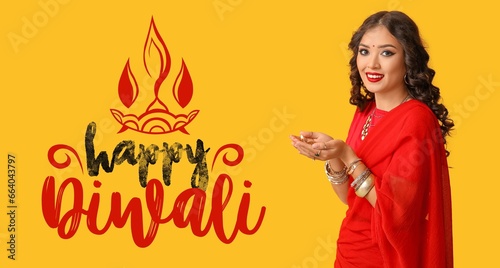 Greeting banner for Diwali (Festival of lights) with Indian woman holding diya lamp on yellow background