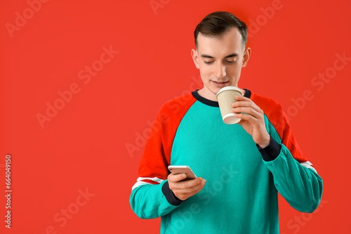 Young man with cup of coffe...