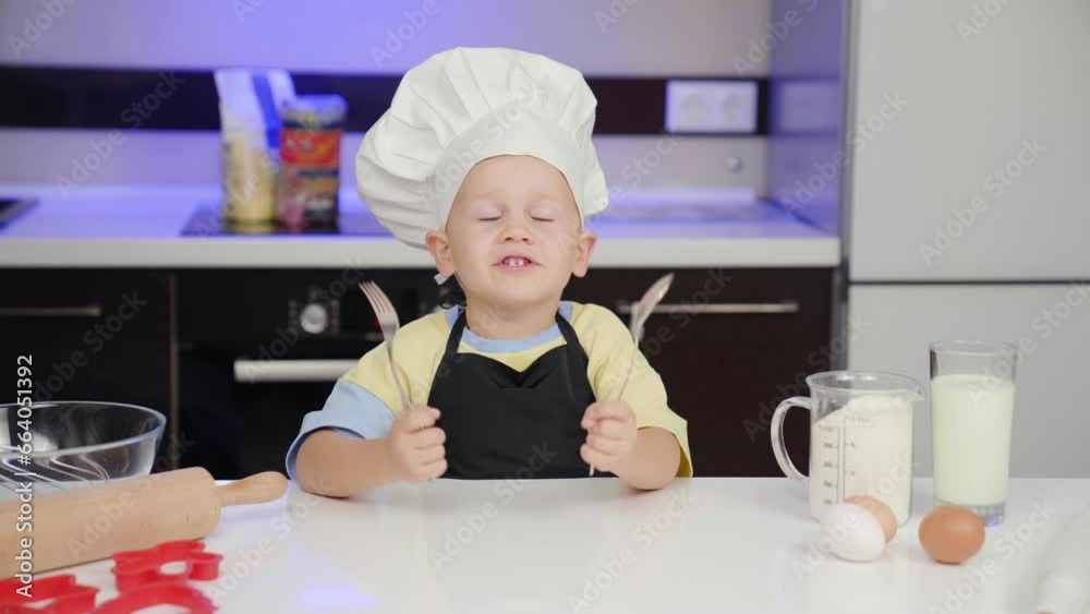Little Chef. Knocks Cutlery on the table. Wants to cook Little Chef. Knocks Cutlery on the table. Wants to cook