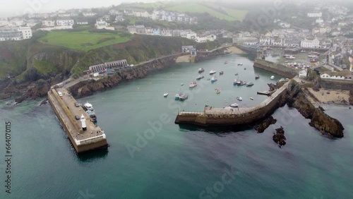 Mevagissey harbour in the mist cornwall uk  photo