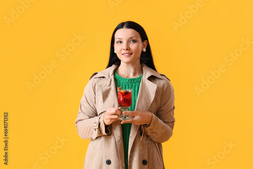 Young woman with glass of m...