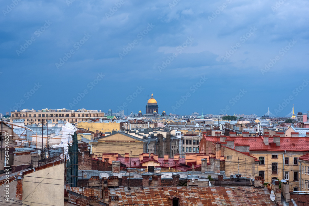 top view of the city roofs in the historical center of Saint Petersburg with rainy sky