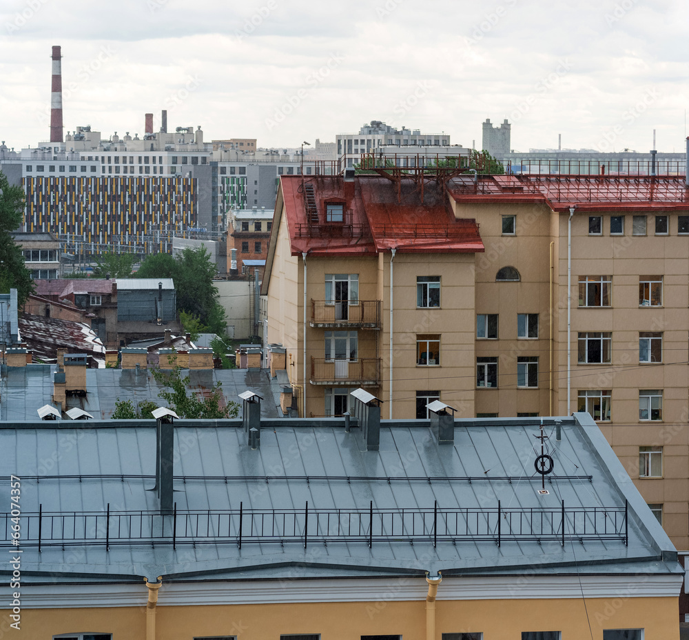Obraz premium cityscape, view from the rooftop to tne old city buildings on a cloudy day in Saint Petersburg