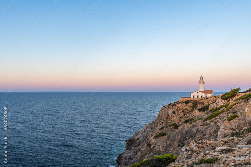 Capdepera Lighthouse at the beautiful coast with the Mediterranean Sea and stunning cliffs of Cala Ratjada on Majorca Island, Spain Capdepera Lighthouse at the beautiful coast with the Mediterranean Sea and stunning cliffs of Cala Ratjada on Majorca Island, Spain