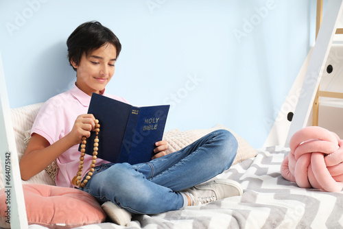 Little boy with Bible and r...