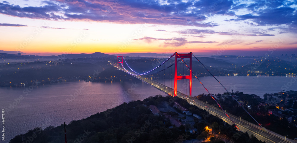 Aerial view of Fatih Sultan Mehmet Bridge in Istanbul, Turkey. Beautiful sunrise view of Istanbul Bosphorus. Drone shot. - obrazy, fototapety, plakaty 