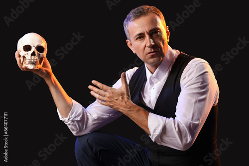 Mature actor with skull on ...
