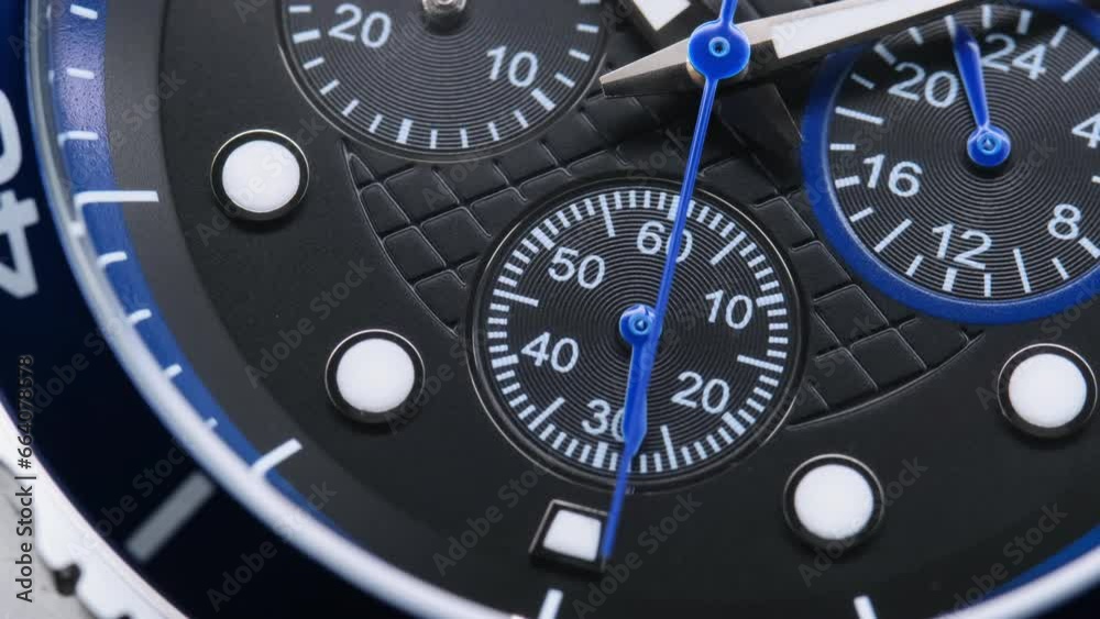 Close Up Of Stylish Luxury Man Wrist Watch With Moving Hand And Multiple Dials. Men's Swiss chronograph watch in metal with sapphire crystal. closeup view of rotating watch , running second arrow Close Up Of Stylish Luxury Man Wrist Watch With Moving Hand And Multiple Dials. Men's Swiss chronograph watch in metal with sapphire crystal. closeup view of rotating watch , running second arrow