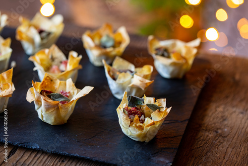 Christmas canapes, filo pastry cups with figs and blue cheese photo