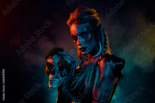 Photo of dangerous wild mysterious lady wear viking clothes holding dead person head isolated dark smoke background