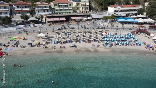 Aerial drone view parga greece, beach crowded with tourists in vacation on summer in famous greek caribbean parga town epirus preveza © tassos stavrou