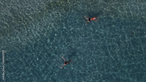 Aerial drone view parga greece, beach crowded with tourists in vacation on summer in famous greek caribbean parga town epirus preveza