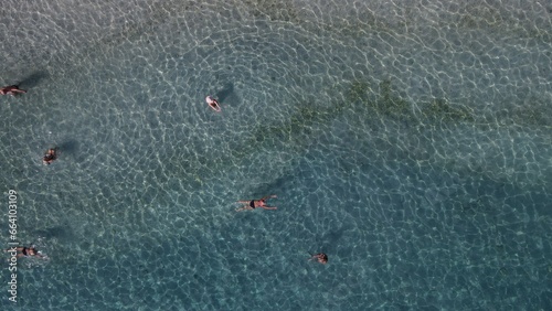 Aerial drone view parga greece, beach crowded with tourists in vacation on summer in famous greek caribbean parga town epirus preveza