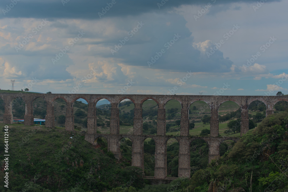 View of arches of ancient aqueduct with three levels