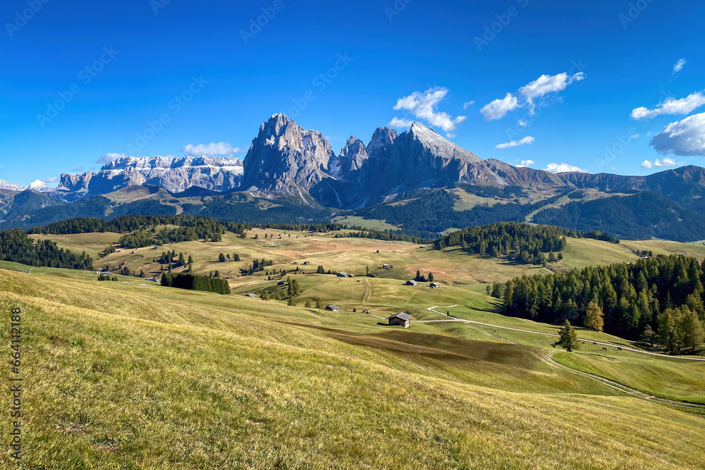 Iconic panorama of Sassolungo - Langkofel mountain group in autumn at Seiser Alm Alpe di Siusi, Dolomites, South Tyrol, Italy