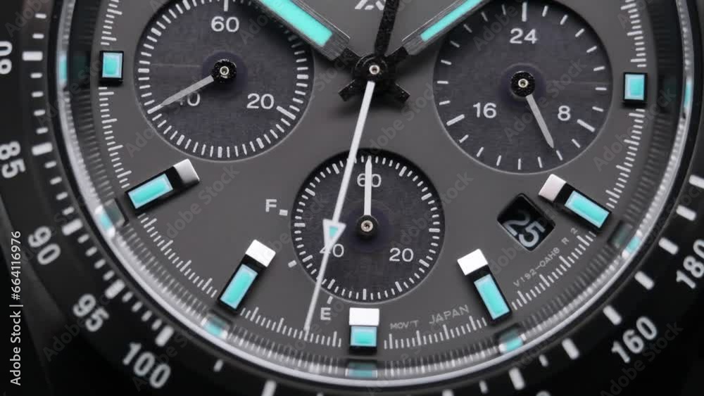 Second arrow running on the black clockface of luxury swiss watch with chronograph. Light flash on the turning clockface. Closeup real time shot. Running second arrow Second arrow running on the black clockface of luxury swiss watch with chronograph. Light flash on the turning clockface. Closeup real time shot. Running second arrow
