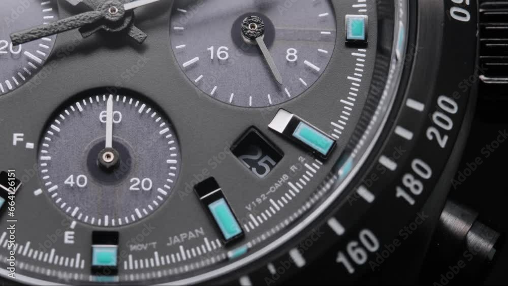 Second arrow running on the black clockface of luxury swiss watch with chronograph. Light flash on the turning clockface. Closeup real time shot. Running second arrow Second arrow running on the black clockface of luxury swiss watch with chronograph. Light flash on the turning clockface. Closeup real time shot. Running second arrow