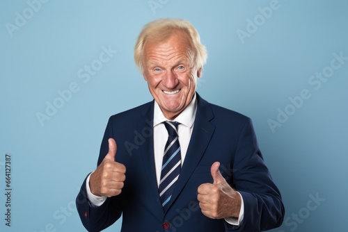 Businessman holding thumb up smile face