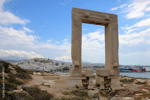 Naxos Portara : The great door of Naxos, remains of an ancient temple on the island of Palatia, with the modern town in the background.