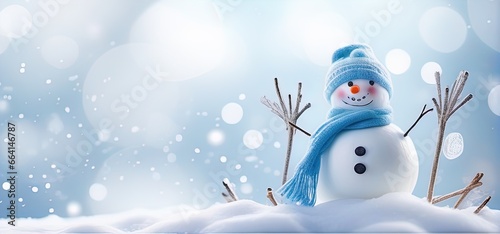 Blue-hatted snowman in winter