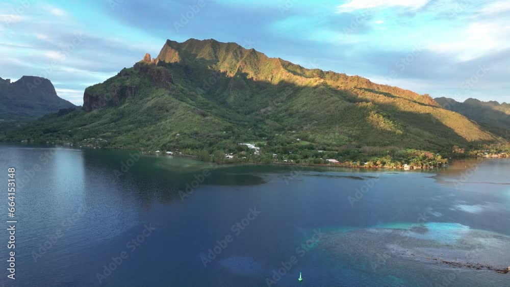 Sunrise Vista Of Mountain And Lagoon In Cook's Bay. Moorea, French Polynesia. aerial pullback Sunrise Vista Of Mountain And Lagoon In Cook's Bay. Moorea, French Polynesia. aerial pullback