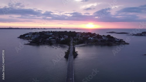 Filmagem aérea do sol nascendo com a Ilha do Frade em primeiro plano. Vitória, Espírito Santo, Brasil. photo