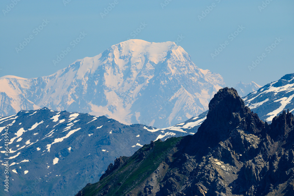View on white snowy top of Mont Blanc highest mountain in Alps and Western Europe from mountain pass Col du Calibier in summer day, Hautes Alpes, France