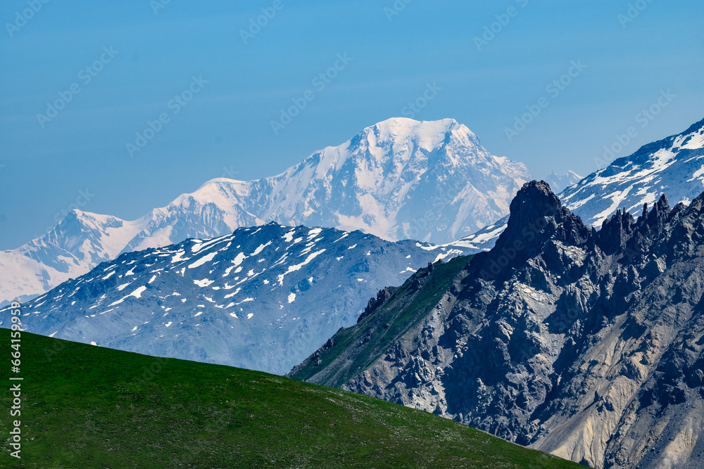 View on white snowy top of Mont Blanc highest mountain in Alps and Western Europe from mountain pass Col du Calibier in summer day, Hautes Alpes, France