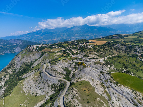 Aerial view on blue Lake of Serre-Poncon, reservoir border between Hautes-Alpes and Alpes-de-Haute Provence   departments, one of largest in Western Europe photo