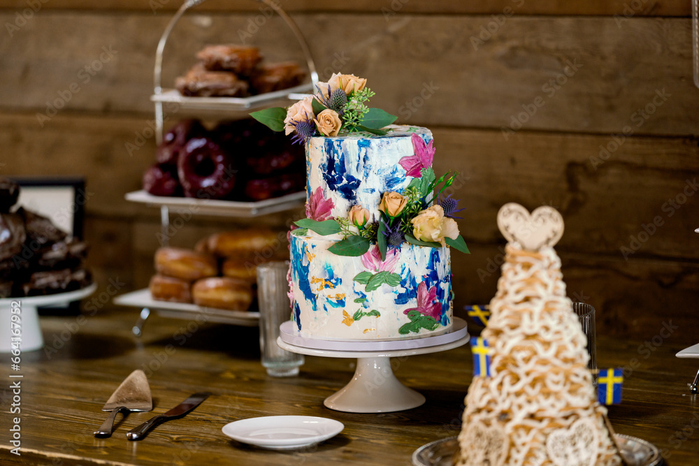 Colorful Wedding Cake at Indoor Reception