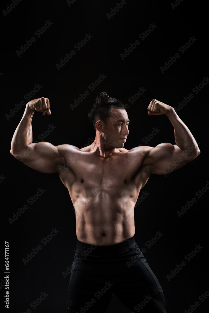 portrait of a  muscular fitness men strong athletic rough man pumping up shoulder muscles workout fitness and bodybuilding healthy concept background 