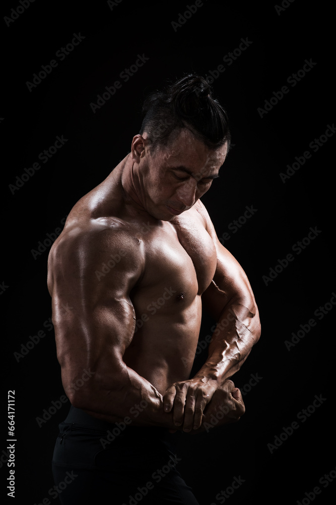 Portrait of muscular male bodybuilder..