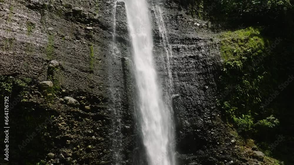 Cold fresh water running down to green plunge pool. Alalum Falls. Mindanao, Philippines. Cold fresh water running down to green plunge pool. Alalum Falls. Mindanao, Philippines.