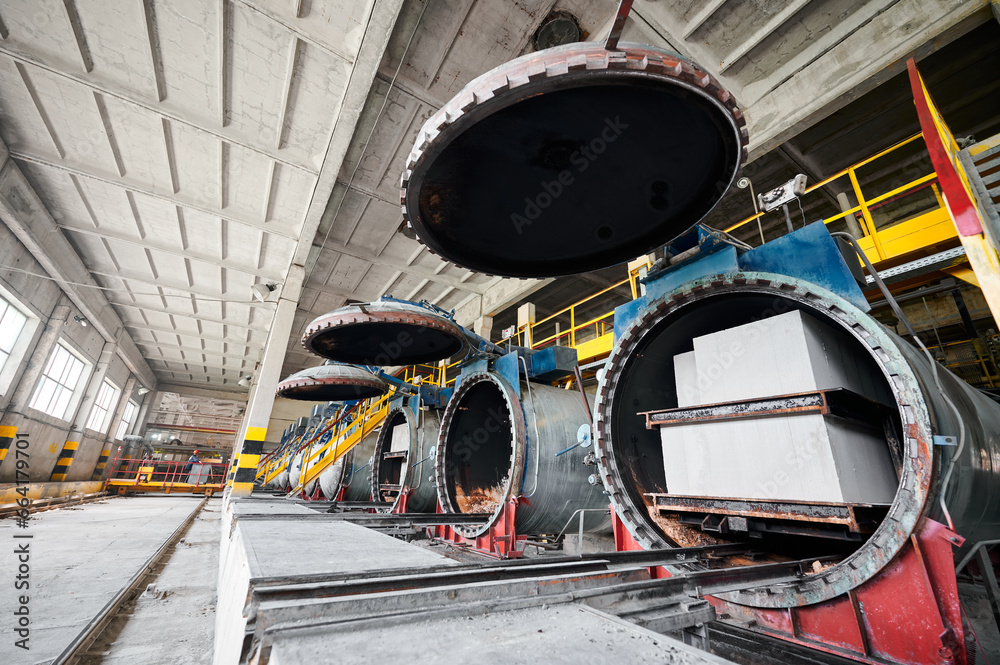 Obraz premium Raw brick blocks loaded into autoclaves at plant workshop