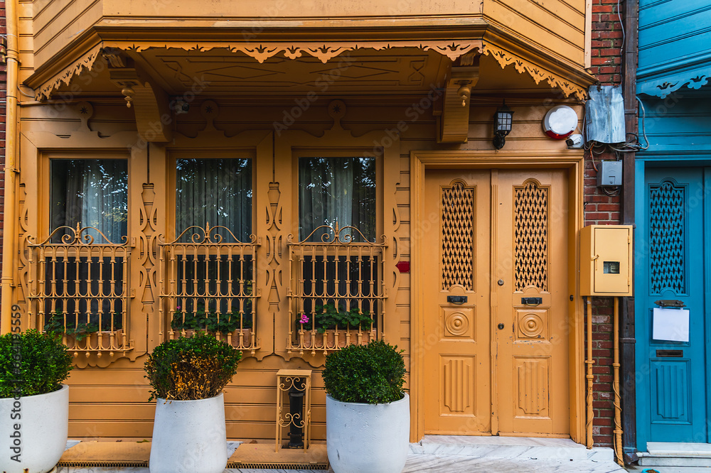 Yellow facade and entrance to a traditional wooden old house in Kuzguncuk district of Istanbul. Yellow facade and entrance to a traditional wooden old house in Kuzguncuk district of Istanbul.
