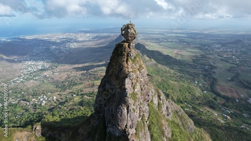 Mountaineer on top of Mount Pieter Both on the island of Mauritius